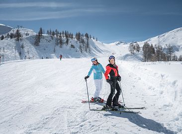 Two skiers on skis in the snow